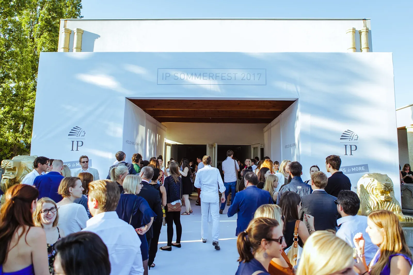 Guests streaming through the entrance of a summer festival